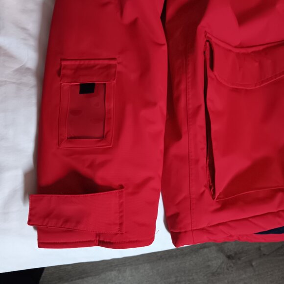 The iconic Abercrombie & Kent expedition red winter coat with blue lining. - Picture 6 of 10